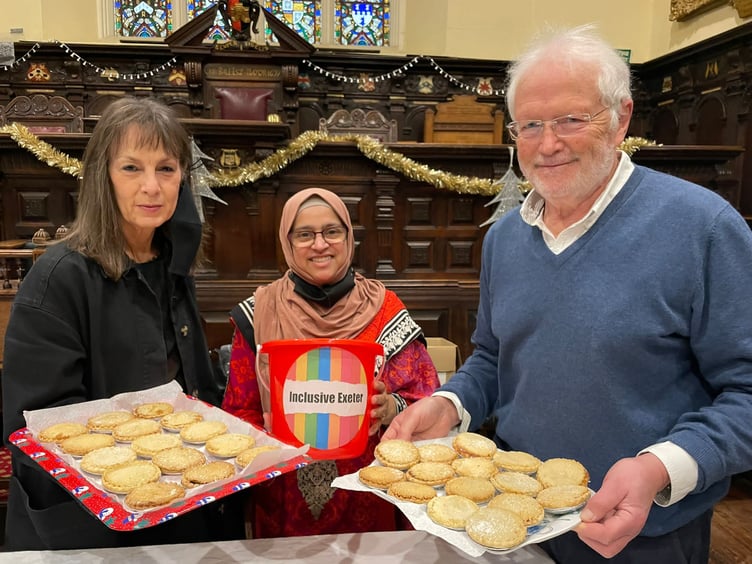 Inclusive Exeter volunteers serving mince pies at Exeter Guildhall.