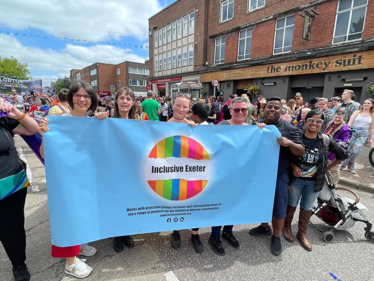 Inclusive Exeter volunteers taking part in an Exeter Pride March.