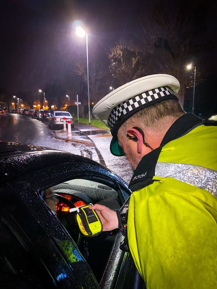 Police conducting a roadside breath test.