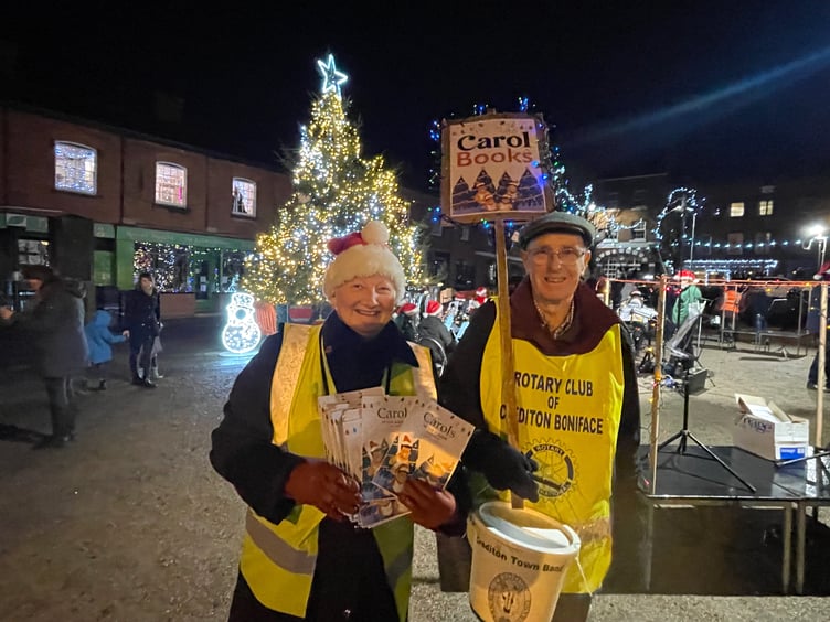 Jenni and David Pitts selling Carol books. AQ 2470