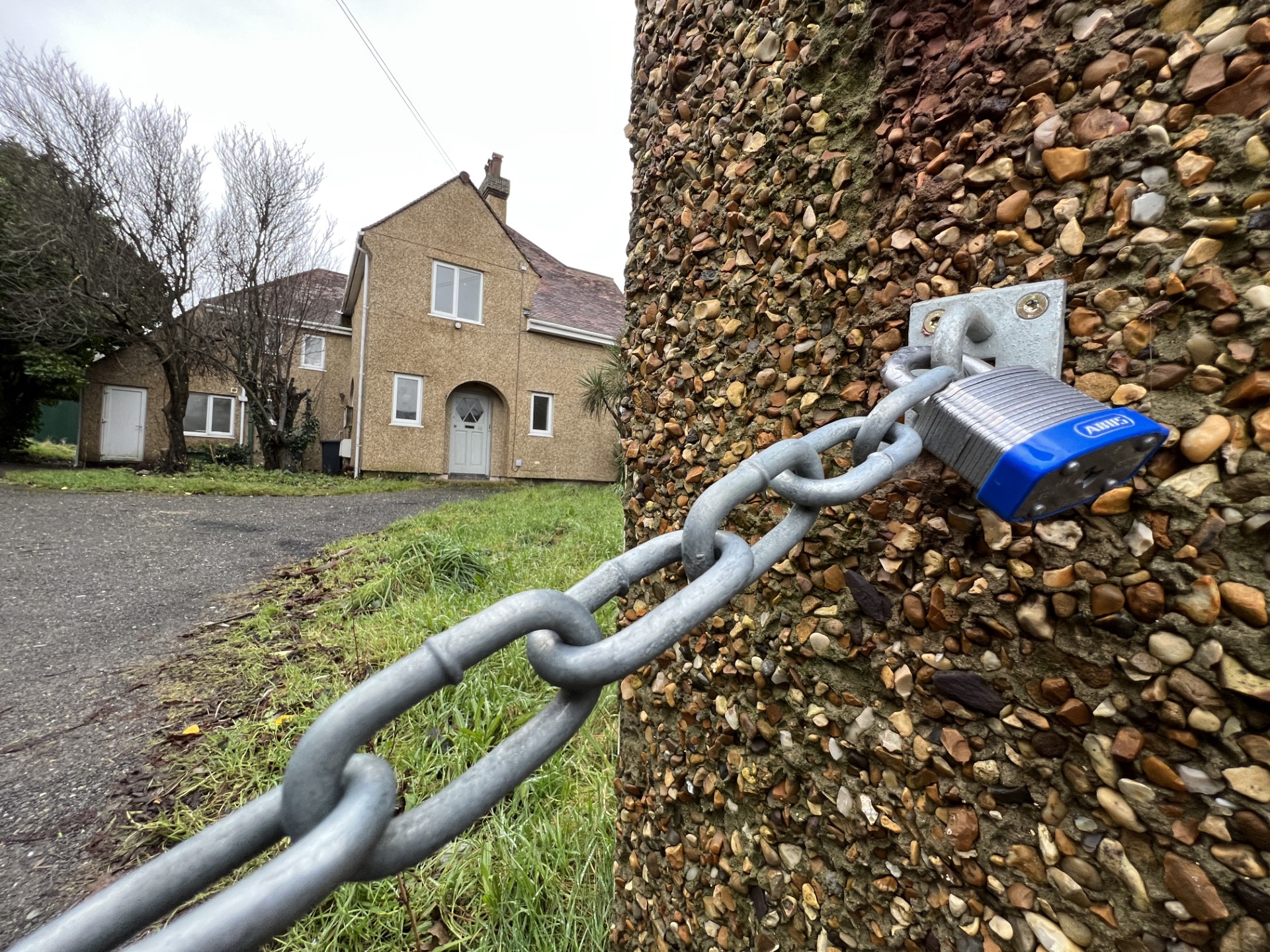 A padlocked chain across the driveway of 40 Westmoreland Road, which has been sold to MDC