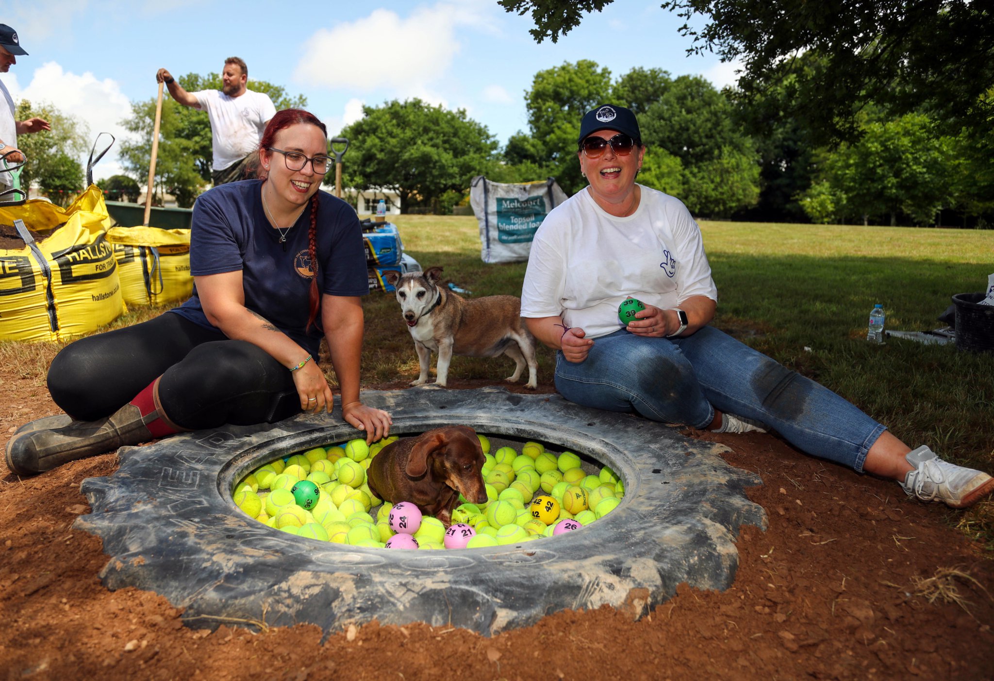 Sarah from the Cinnamon Trust, Charlie Brown and Jake inspect National Lottery wnner, Zoe Hoare's ballpit build at the ‘pet retirement home .
21 June 2023 , Lewdown Devon .
