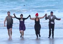 Swimmers take on New Year's Eve dip in their ballgowns 