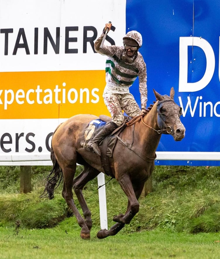 Caoilin Quinn salutes the crowd after Nassalam's emphatic victory