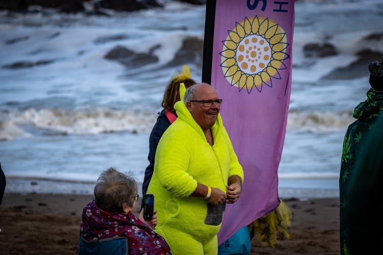 A vibrantly dressed St Margaret's dipper prepares for their dip.