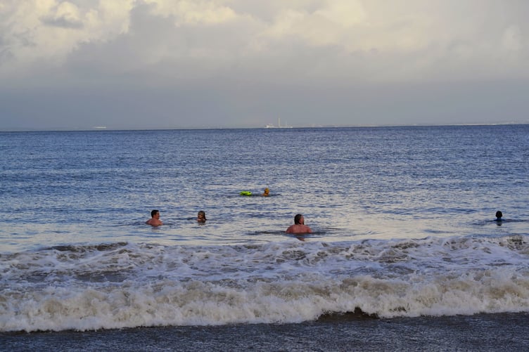 Dippers entering the water at Minehead Beach.