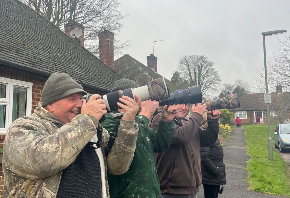 <p>Birdwatchers Richard Kernachan, Shean King and and Simon Thorn wait for the perfect photo of a waxwing at Haven Way opposite Farnham Hospital</p>