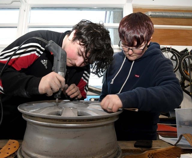 Pupils maintain cars as part of lessons ahead of entering the world of work
