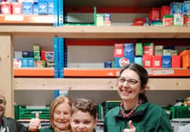 Local schoolboy helps out at Foodbank as part of fundraising mission