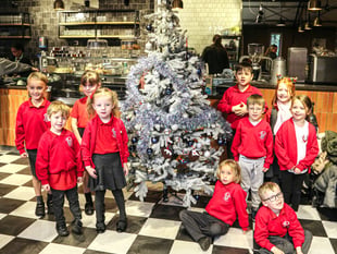 Badshot Lea Village Infant School pupils bring festive cheer