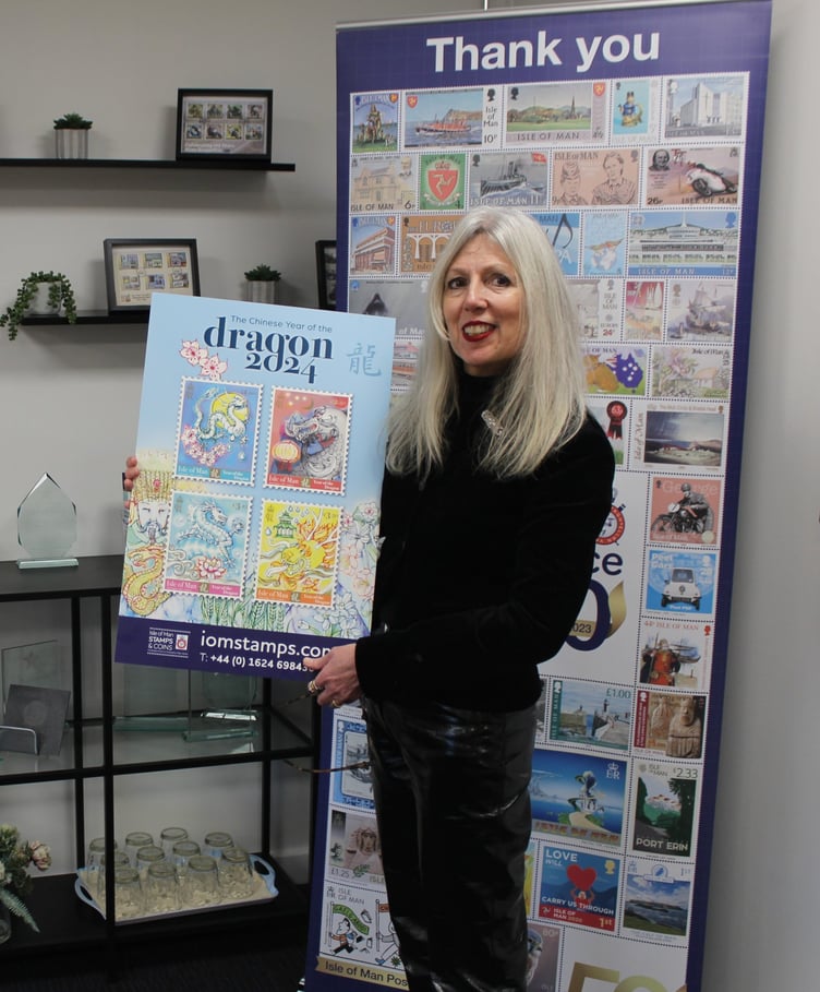 Designer Jo Davies with her Chinese Year of the Dragon stamps