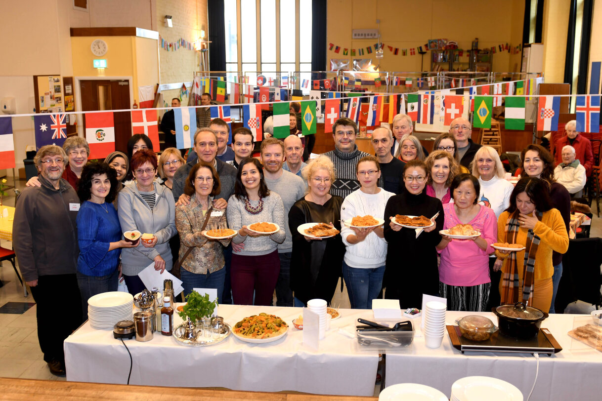 Main: An international food festival hosted by multicultural community organisation Cafe Lingo. Inset below: Karen Norton who has spent eight years helping people adjust to Manx life