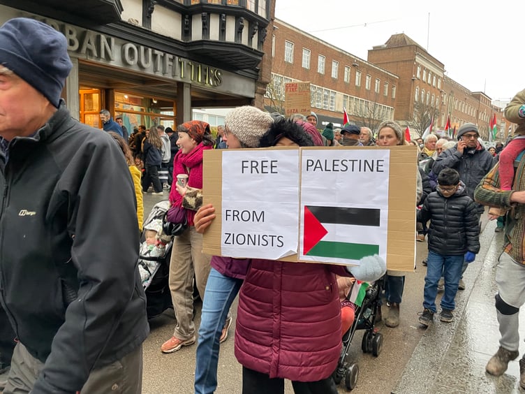 One of the protestors with their placard.