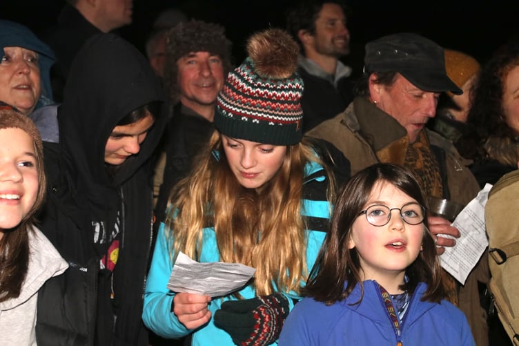Singing the Wassail song. AQ 3462