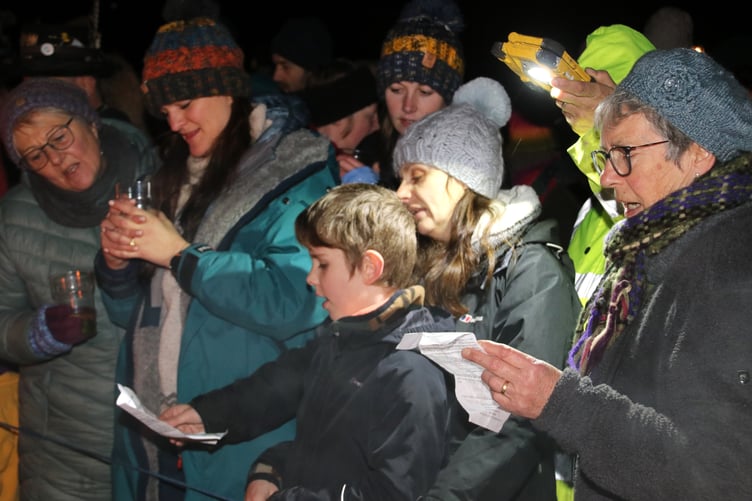 Singing the Wassail song. AQ 3464