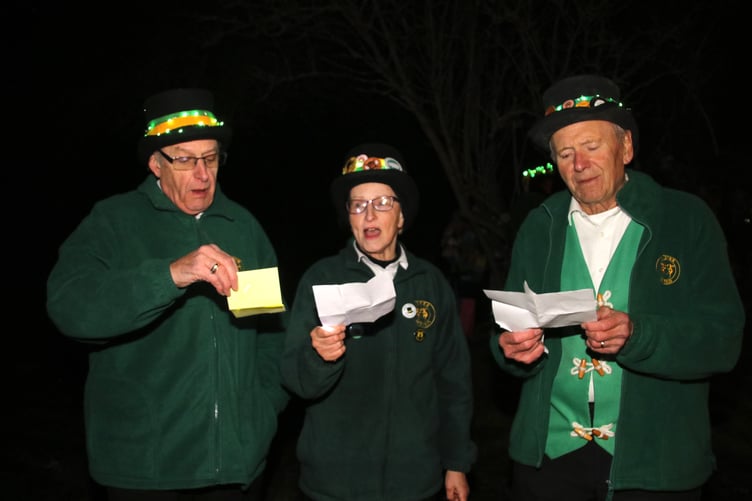 Singing the Wassail song. AQ 3459