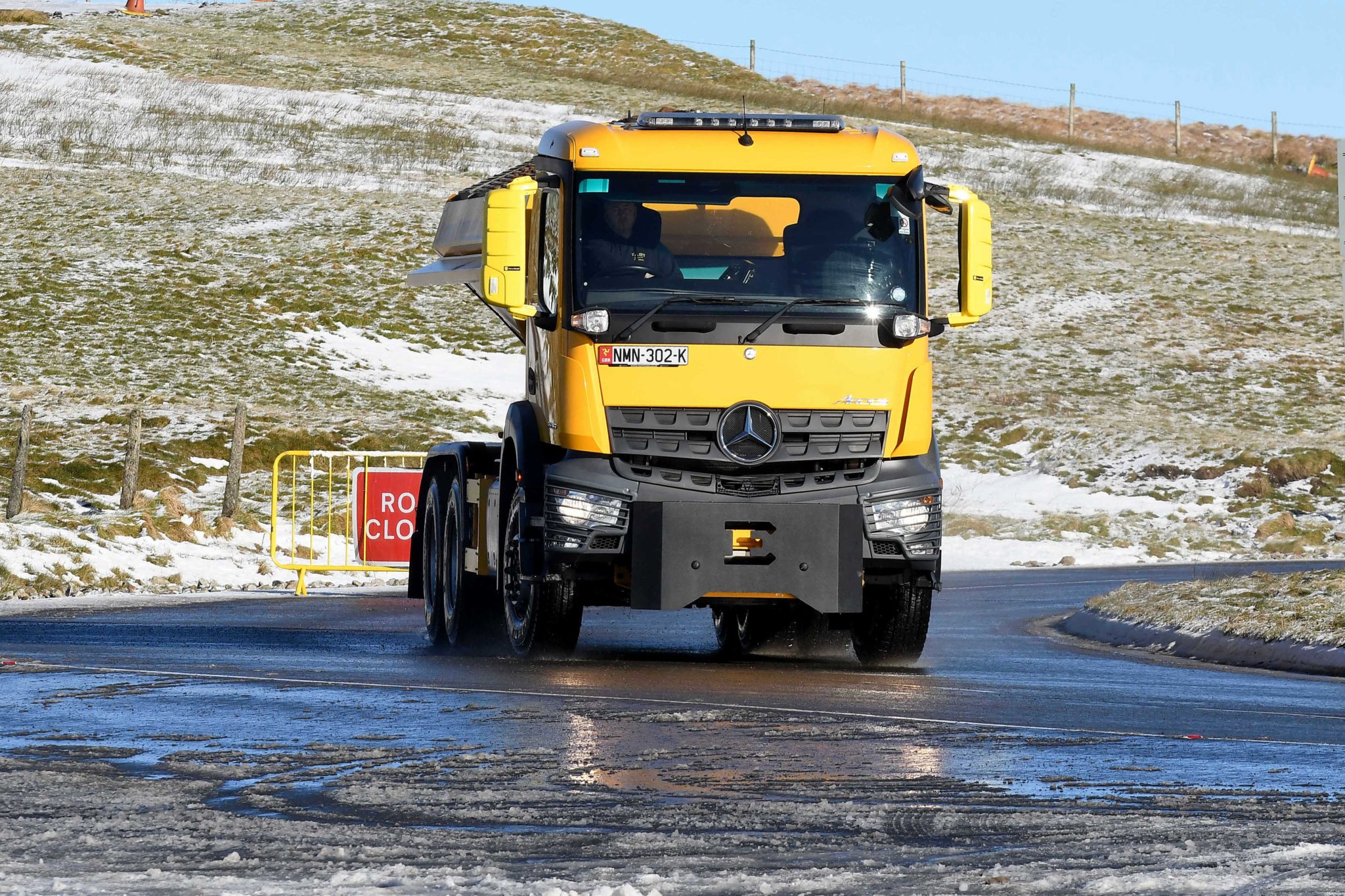 A gritter in action on the Mountain Road