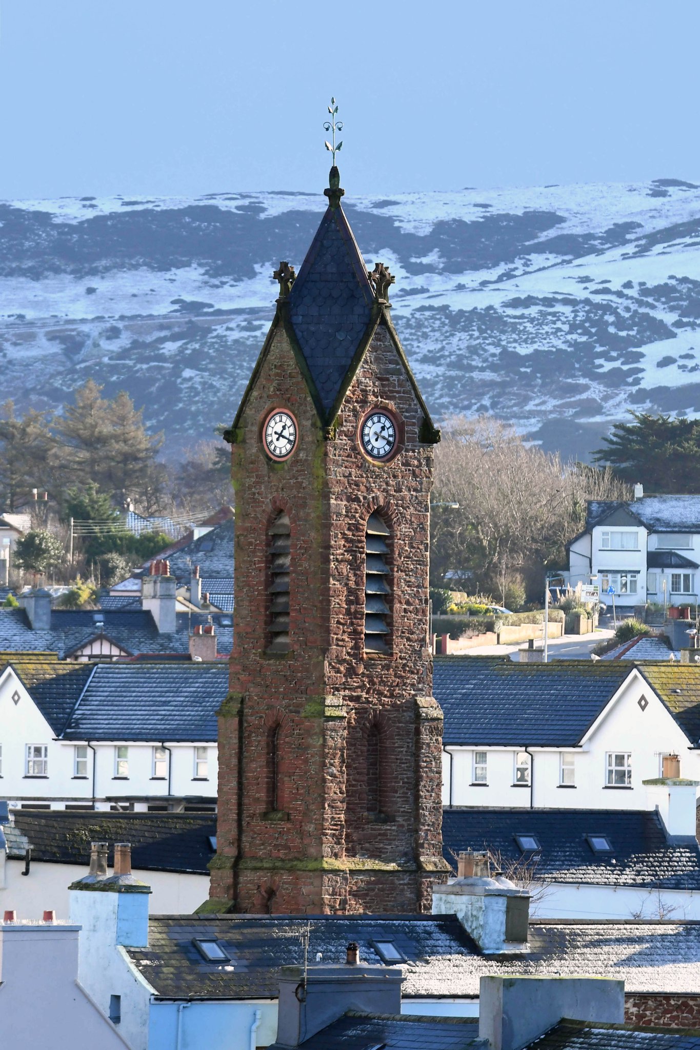 A snowy backdrop to the ruins of St Peter’s church in Peel