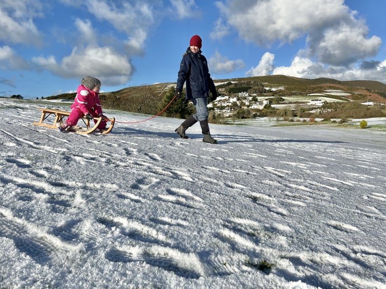 Ella Darbyshire, three, and mum Jackie enjoy a spot of tobogganing at Rowany, Port Erin