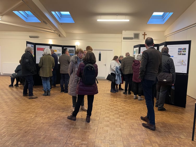 Members of the public looking at the Masterplan consultation documents. AQ 3600