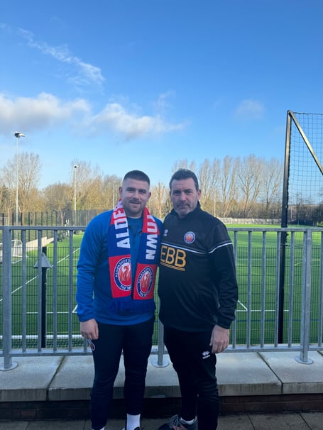 Josh Barrett (left) with Aldershot Town manager Tommy Widdrington