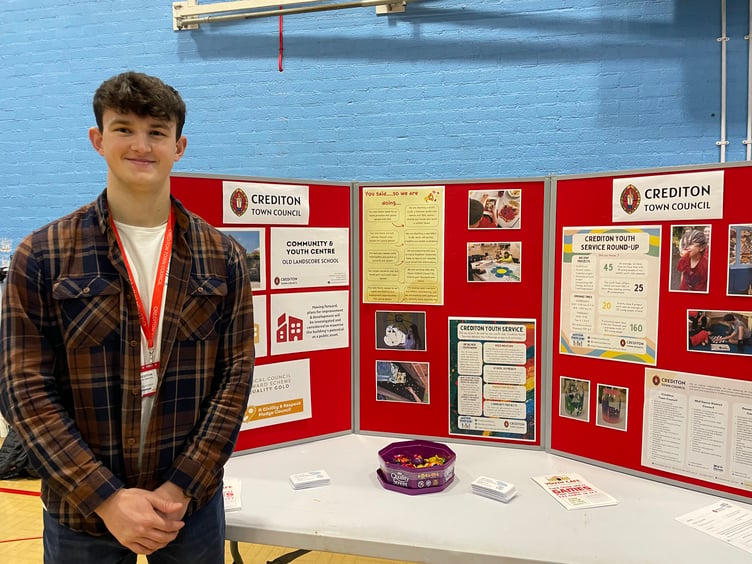 Reece Burnison, Peer Mentor, ran the Crediton Youth Service/Crediton Town Council stall. AQ 4172