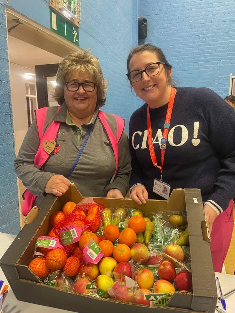 Hazel Evely, Crediton Morrisons Community Champion took along lots of fruit for those attending, pictured with Town Clerk Rachel Avery. AQ 4126