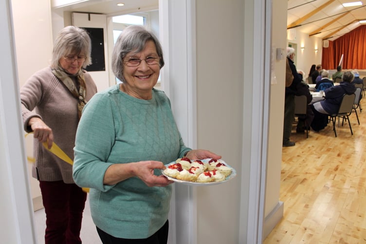 Sally Burton with a plate of cream teas. SR 9435