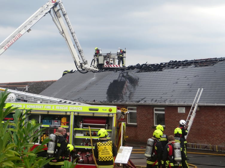 Fire crews at work at the burning Village Hall in September 2022. SR 2918