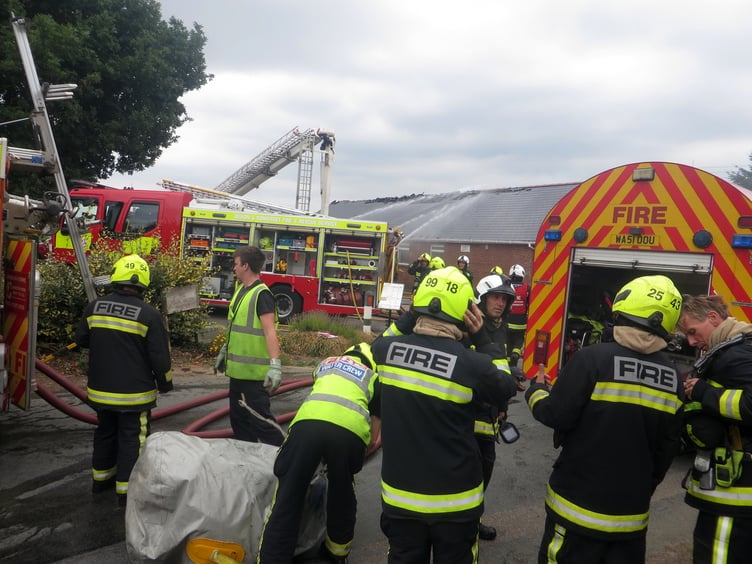 Fire crews at work at the burning Village Hall in September 2022. SR 2909