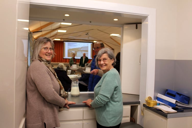 Committee members Elaine Clark (left) and Sally Burton at the kitchen hatch. SR 9427
