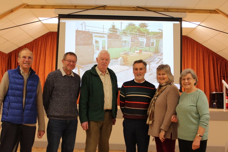 Committee members left to right Dennis Milton, Peter O’Neill (treasurer), Jon Whitehead (chairman), David Tripp, Elaine Clark, Sally Burton with a picture of the work at the hall on the big screen behind them. SR 9432