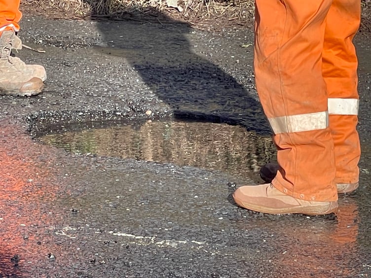 At the water leak on Jockey Hill in Crediton. AQ 4363