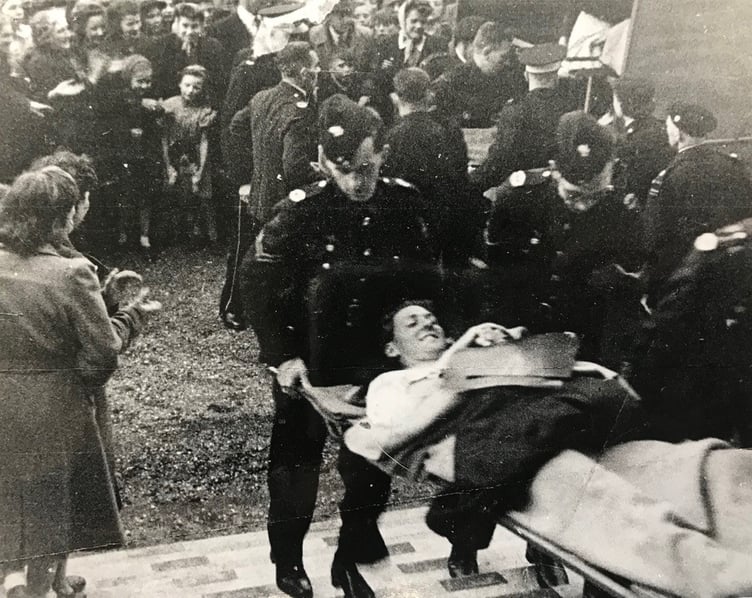 Richard Willis is pictured on a stretcher after he was wounded in the D-Day landings in the Second World War.
