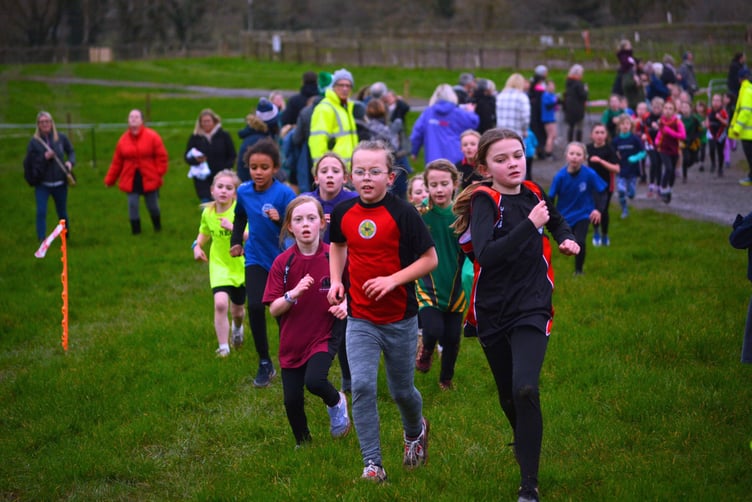 Year 5 and 6 girls racing to the finish line