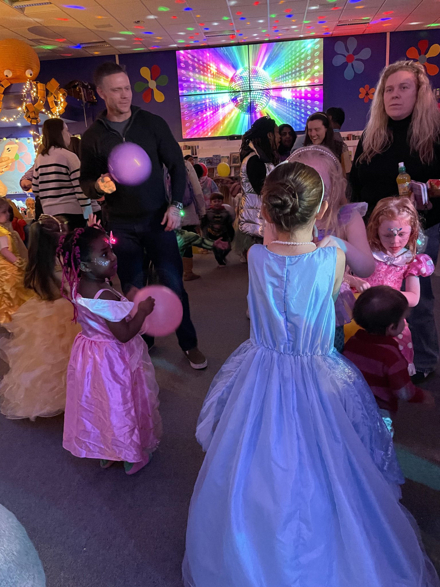 Families take to the dancefloor for the Disney-themed disco