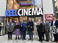 <p>Chancellor Jeremy Hunt cuts a film reel to open Farnham's new REEL Cinema</p>