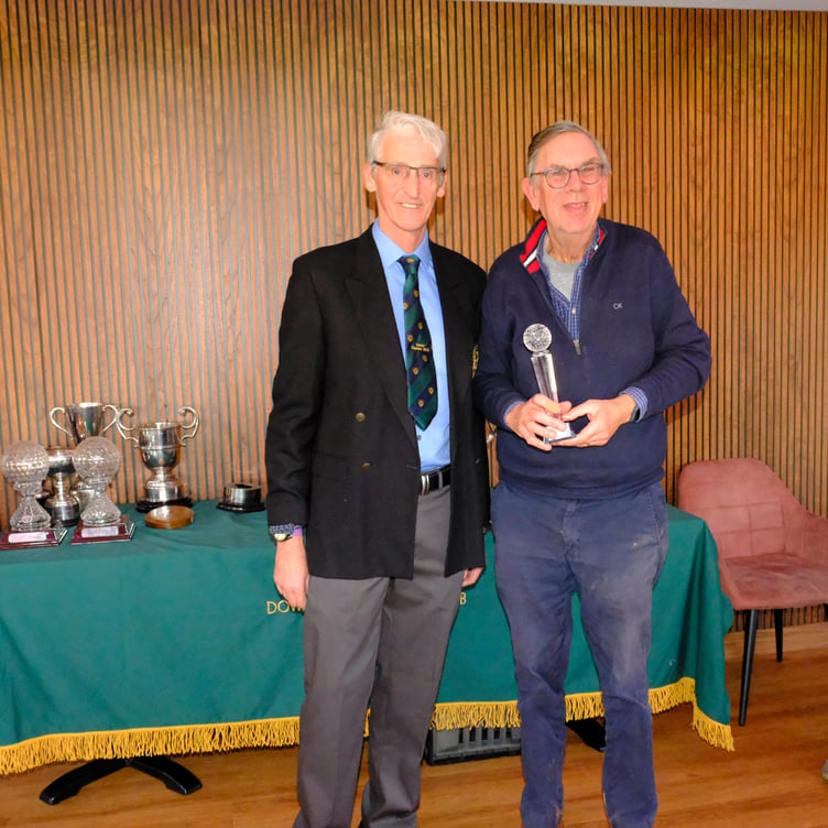 David Cousins receiving the Grandads Trophy from Seniors Captain Jim Enright.