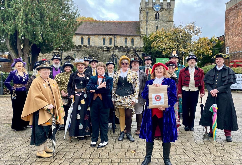 <p>Petersfield town crier Faye Thomson with the Gosport steampunk group</p>