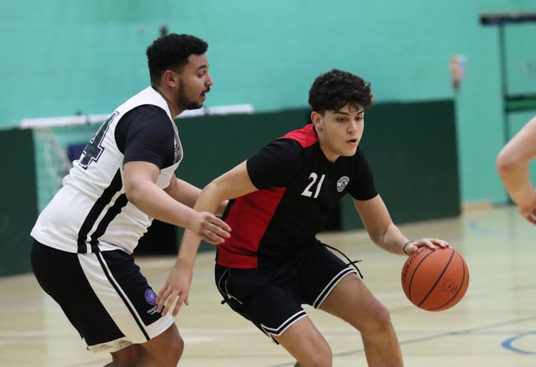 Ravens Miltos Provatakis drives against the close defence of Jets Peter Boussougou (left)