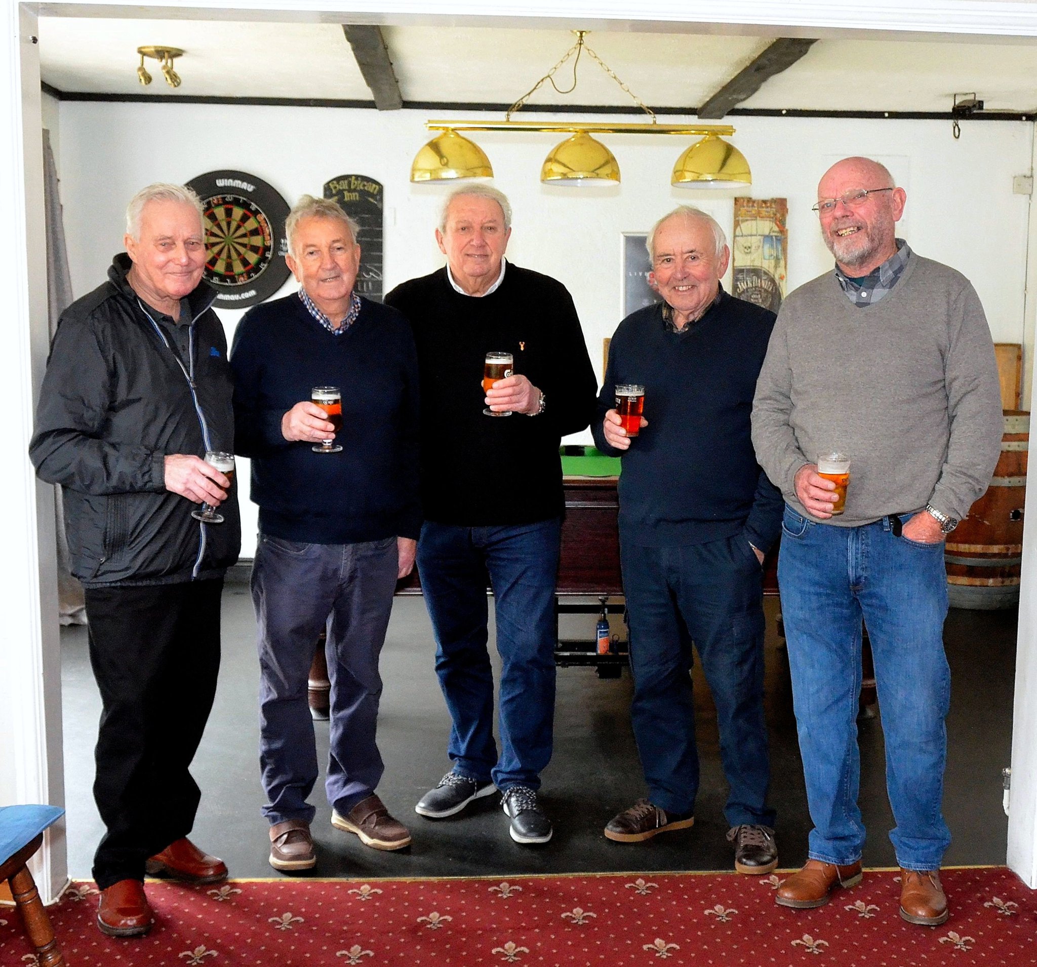 LEFT: Ivor Toms, Neil Pearce, Neil Richardson, Harry Southern and Jim Soady in 1964 during their holiday in Belgium; Above, the group recreated the photograph at the Barbican Inn, Looe