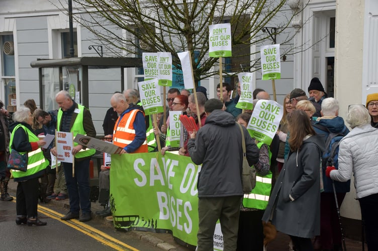 Anti-bus cuts protesters gather in North Street, Wiveliscombe.