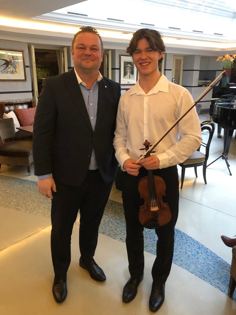 Violinist Anthony Knight with Jan Korta, director of sales and marketing, in the Aria Hotel, Prague.