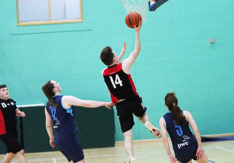 Ravens’ Zak Mitchell goes for the lay-up through Hoops defence as his side triumphed 68-44