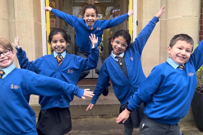 Children celebrate South Farnham School being ranked as the best primary in England by The School Guide