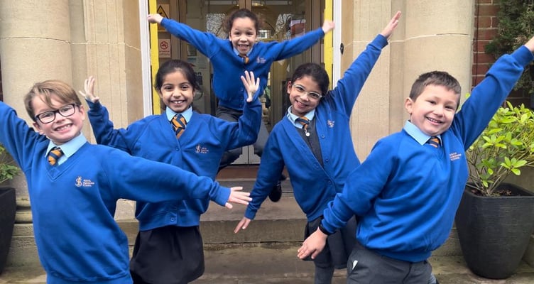 Children celebrate South Farnham School being ranked as the best primary in England by The School Guide