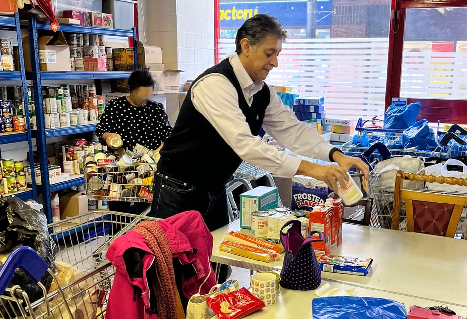 <p>Lib Dem candidate for Farnham and Bordon, Khalil Yousuf, helping out at Bordon Foodbank</p>