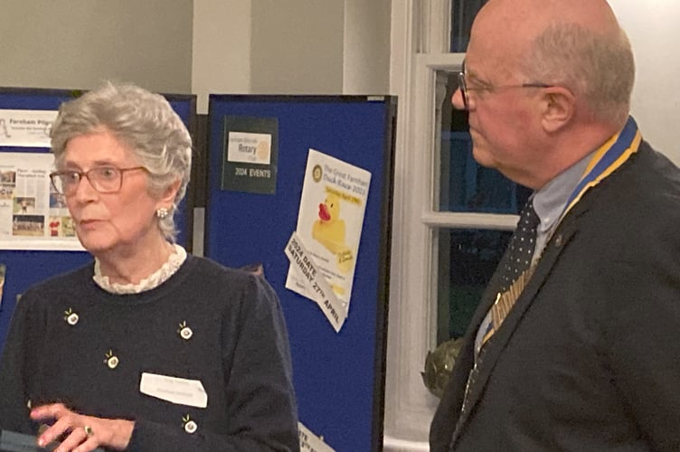 Farnham Weyside Rotary president John Lewis presents Rotary's Paul Harris Award to Meg Daniels of the Farnham Institute Charity