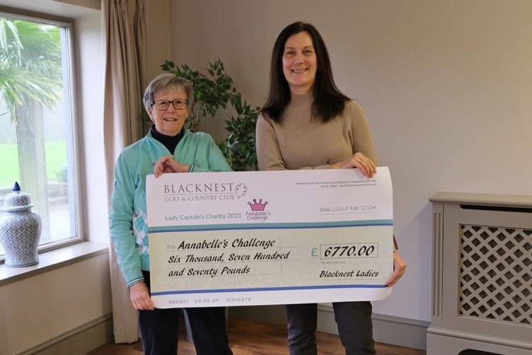 Blacknest Golf Club ladies captain Sue Hunt presents a cheque to Jacqui Fish of Annabelle's Challenge.