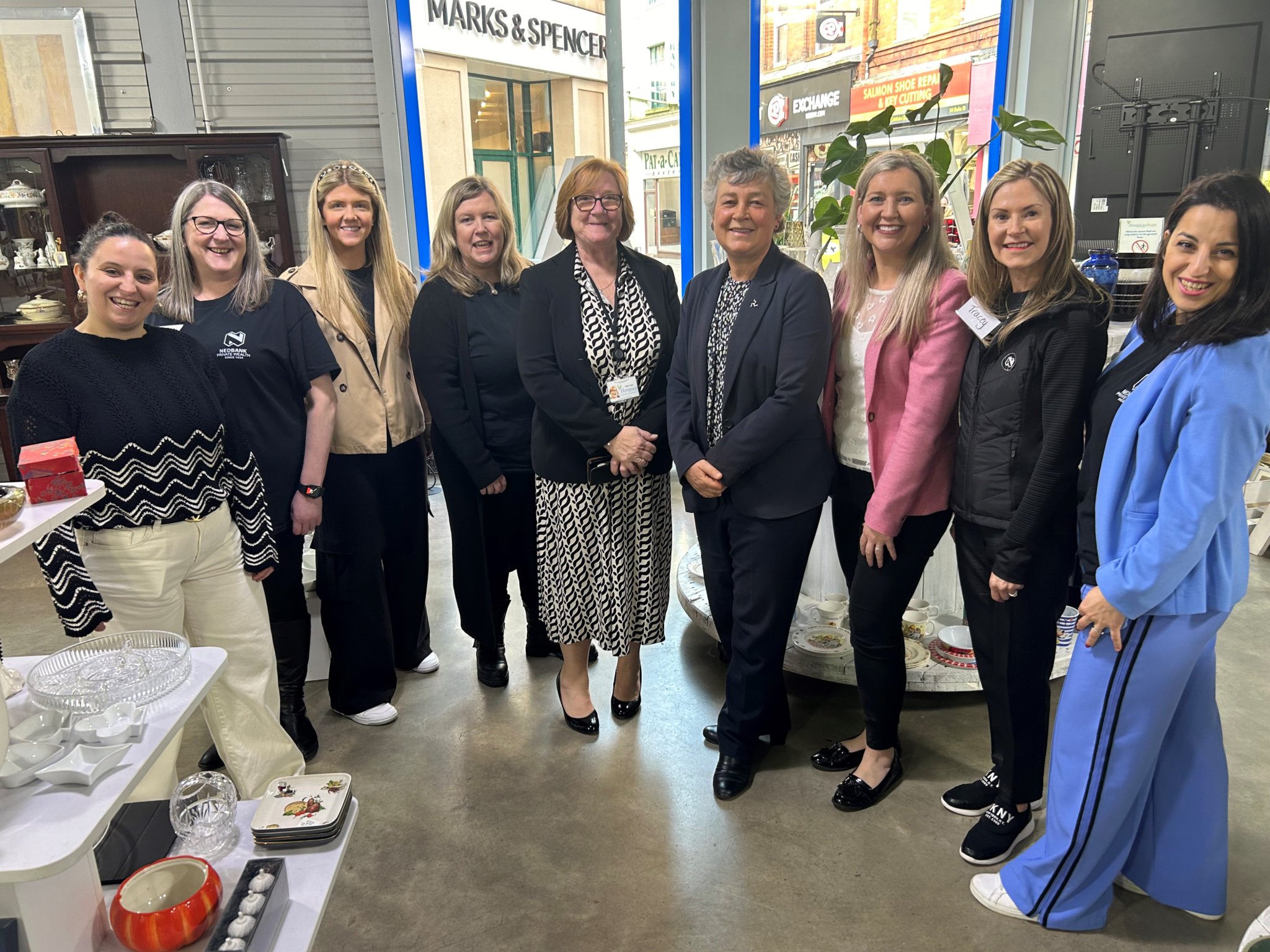 Nedbank volunteers with Lady Philippa Lorimer (fourth from right) at Hospice’s Duke Street store in Douglas